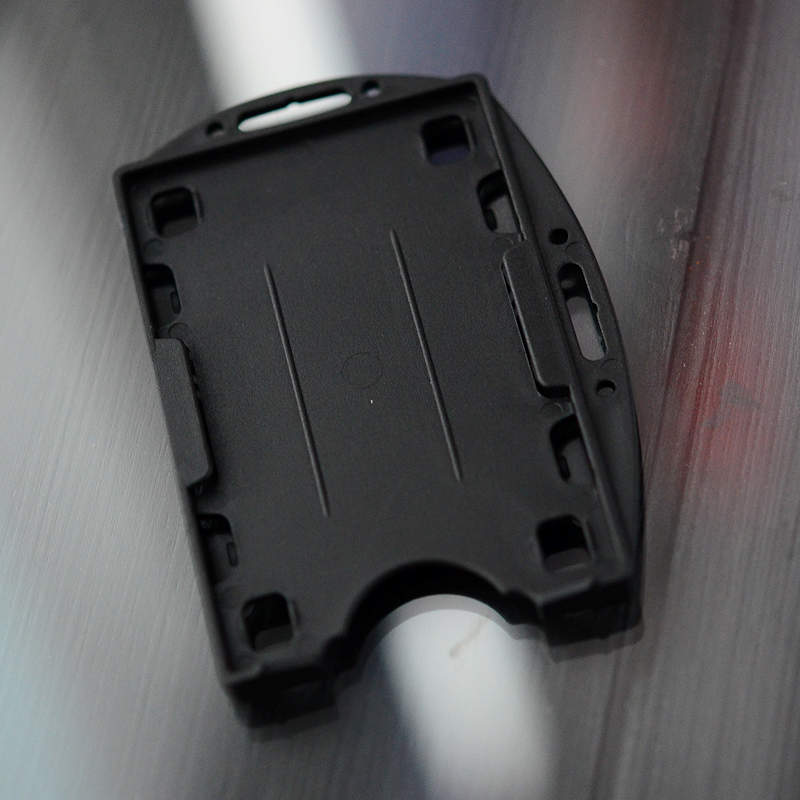 Black Double sided twin ID-card holder for two standard size ID-cards. Can be worn vertically or horizontally. Each card is on separate sides of the card holder.