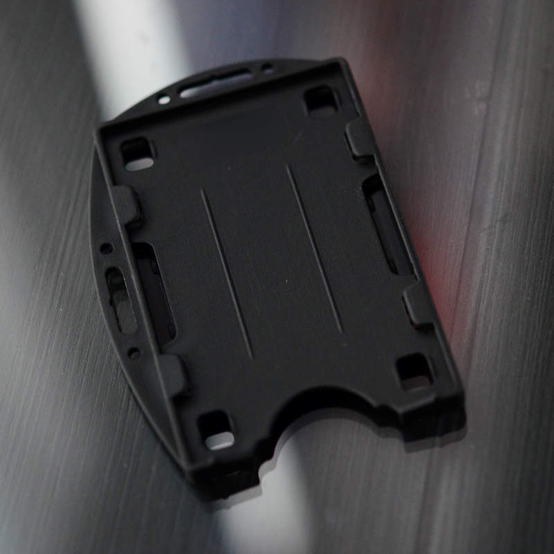 Black Double sided twin ID-card holder for two standard size ID-cards. Can be worn vertically or horizontally. Each card is on separate sides of the card holder.