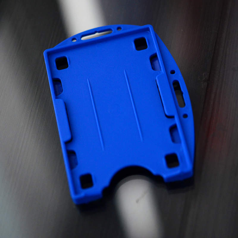 Blue Double sided twin ID-card holder for two standard size ID-cards. Can be worn vertically or horizontally. Each card is on separate sides of the card holder.