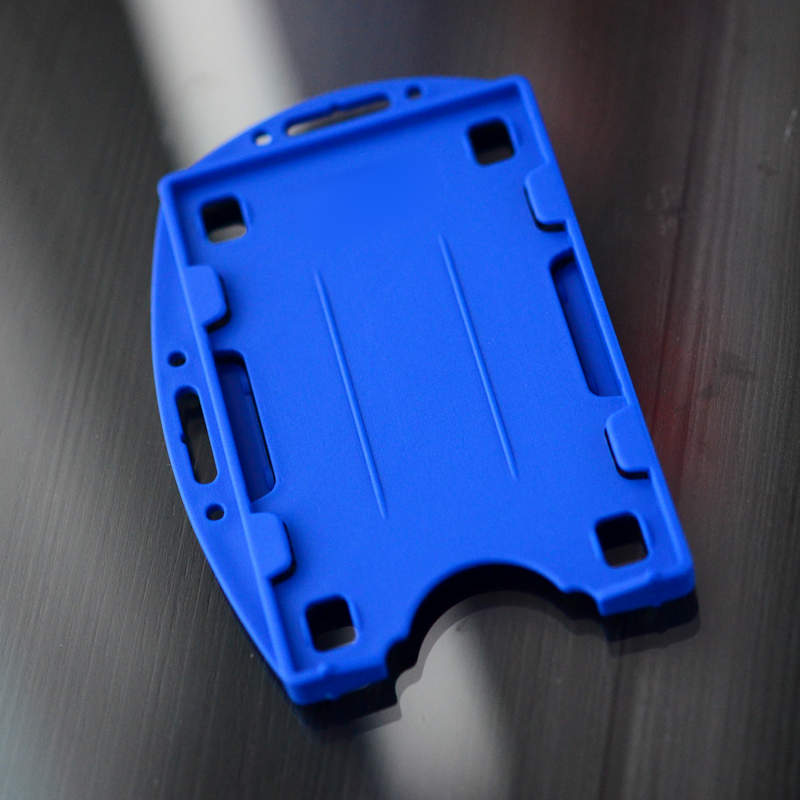 Blue Double sided twin ID-card holder for two standard size ID-cards. Can be worn vertically or horizontally. Each card is on separate sides of the card holder.