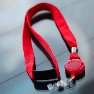 Red 16mm flat polyester lanyard with safety buckle with red badge reel with vinyl strap