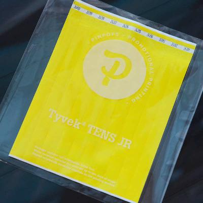 Yellow Tyvek Tens wristband with a permanent closure. Prenumbered in sequential order.