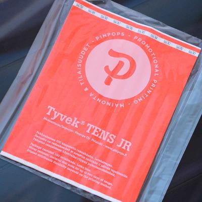 Neon Orange Tyvek Tens wristband with a permanent closure. Prenumbered in sequential order.